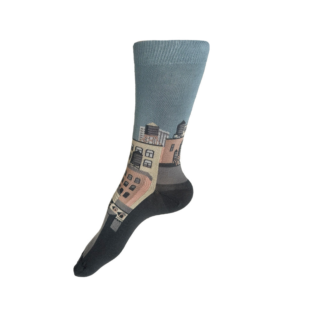 Made in USA women's cotton NYC cityscape sock featuring buildings and water towers on blue-grey sky background by THIS NIGHT