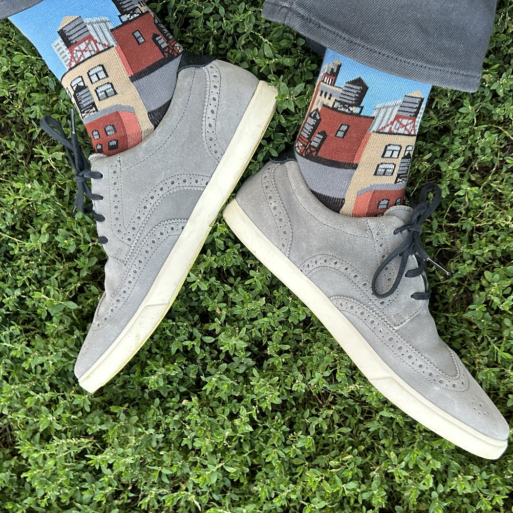 Made in USA men's blue cotton socks with NYC citycape skyline design featuring Empire State Building and water towers by THIS NIGHT