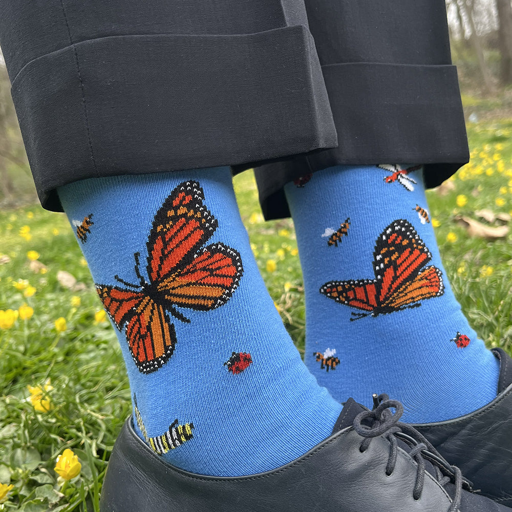 Women's cotton bug socks featuring monarch butterflies, a caterpillar, ladybugs, and honeybees by THIS NIGHT