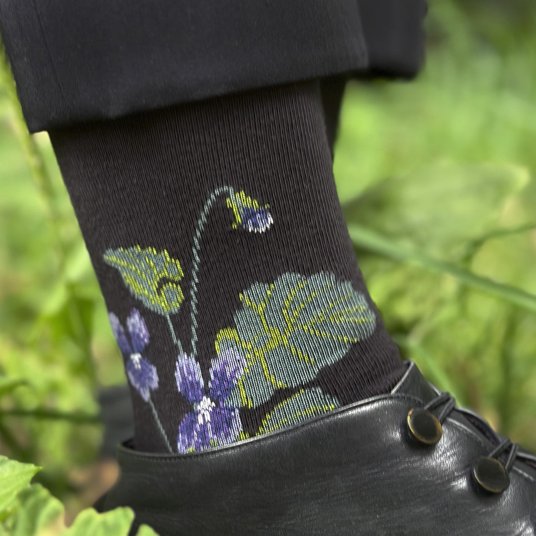 Made in USA women's cotton floral socks with violets and leaves on black background