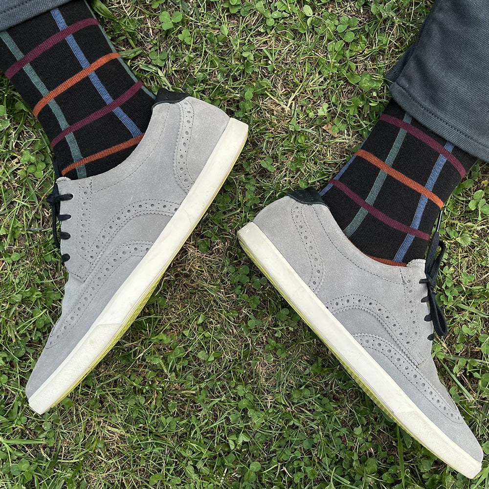 Made in USA men's geometric socks in an autumnal grid pattern in blue, green, rust, and burgundy by THIS NIGHT