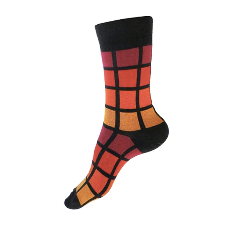 MADE IN USA women's black geometric cotton socks inspired by R62A NYC Subway car with maroon, paprika, orange, + yellow-orange pattern